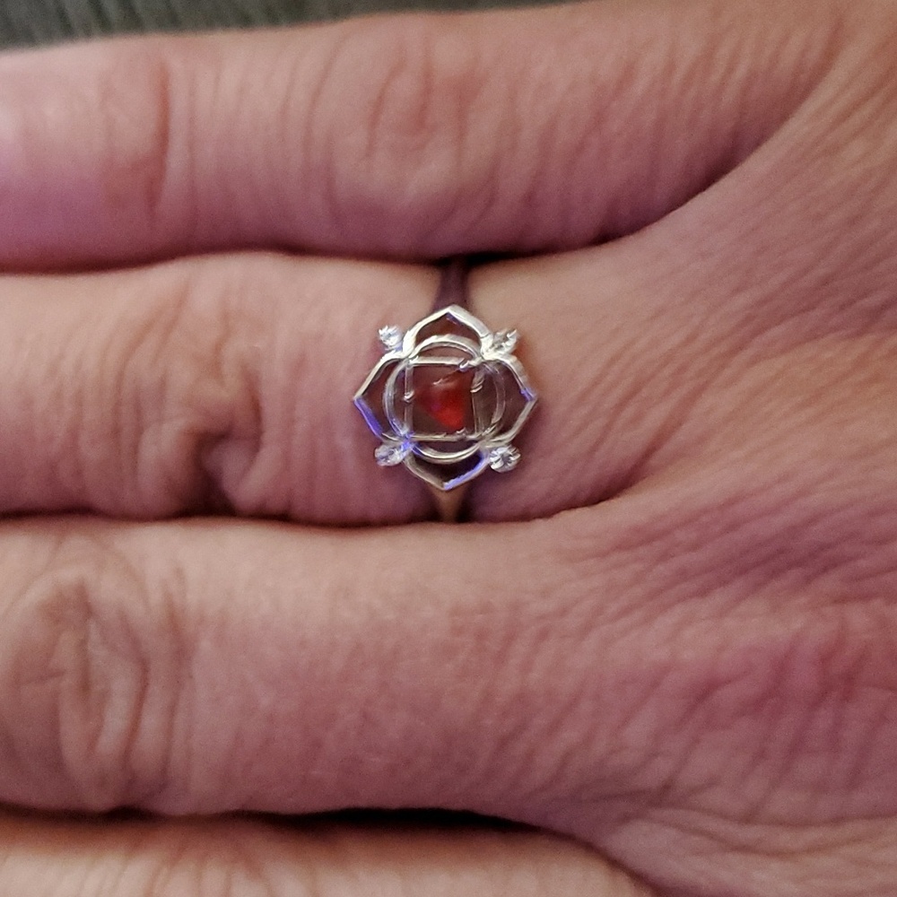 STERLING SILVER WITH REDDISH ORANGY STONE